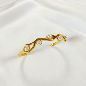 18k gold plated organic wave pearl bangle. 18k gold plated organic wave pearl bangle.