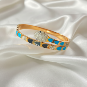 the serpentine elegance: gold tone enamel & crystal snake bangle